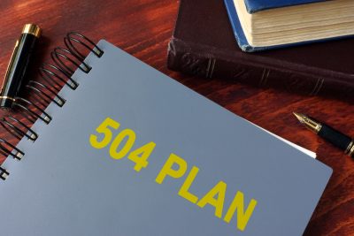 Book with title 504 plan. Special education concept.
