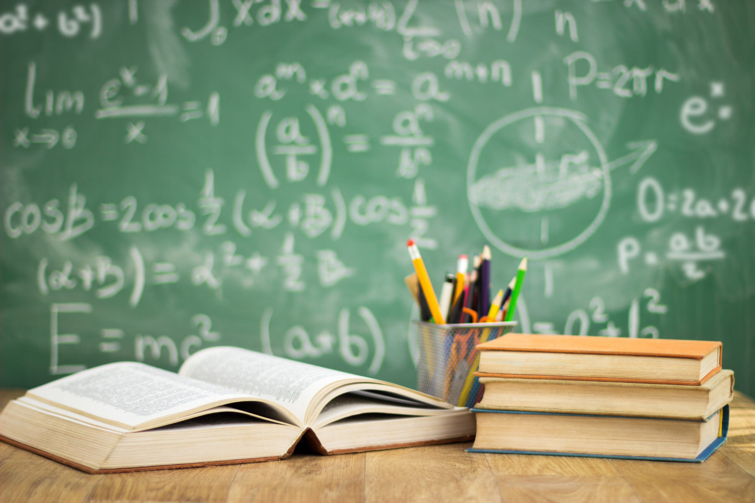 School books on desk, education concept