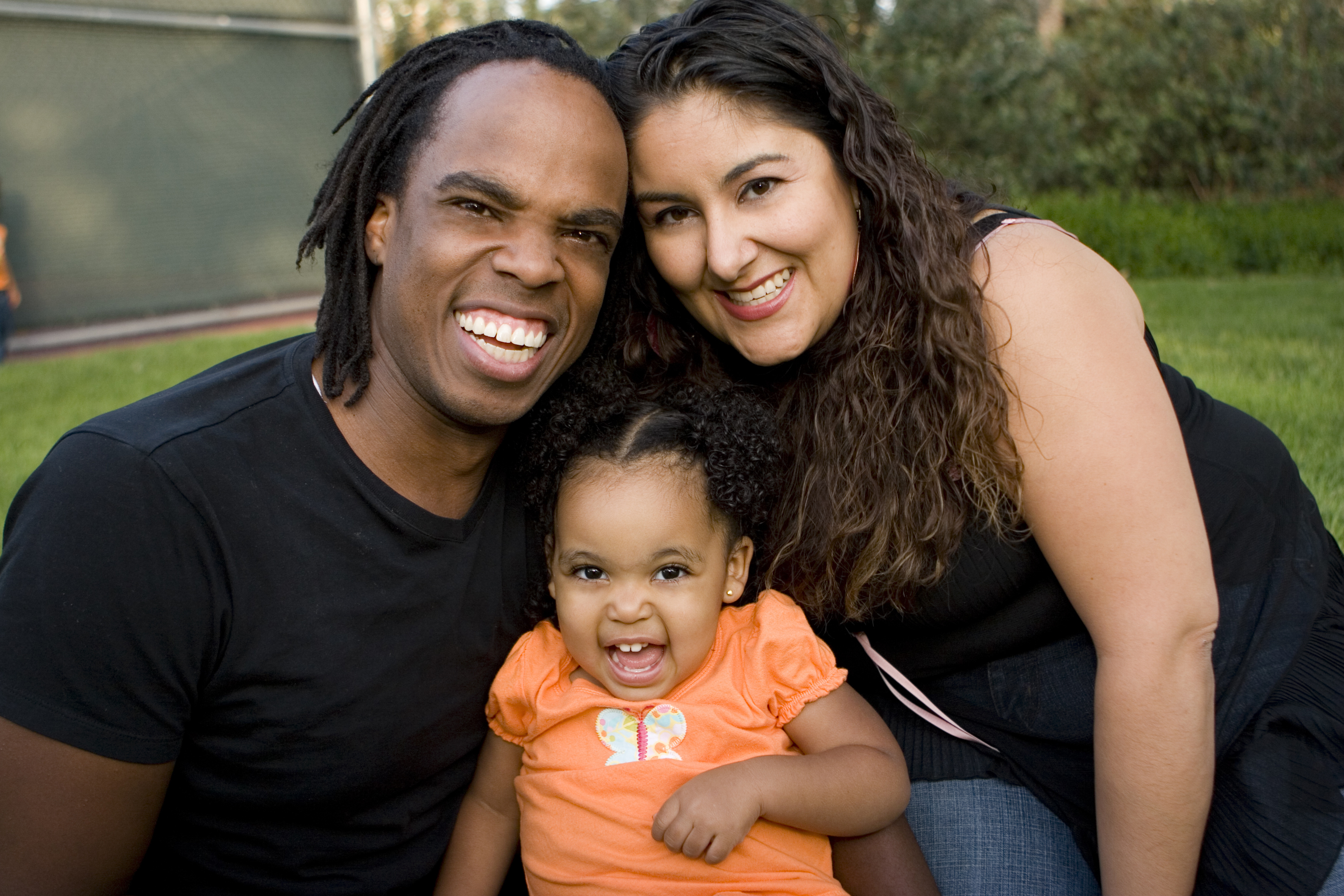 Portrait of a happy family at a park.