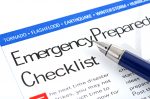 fountain pen lying on " Emergency Preparedness Checklist form