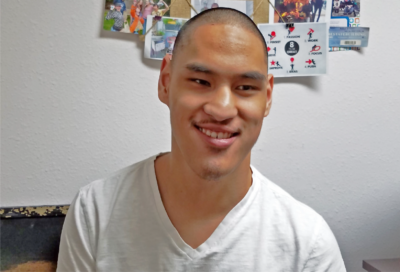 Young Man posing in front of the camera smiling