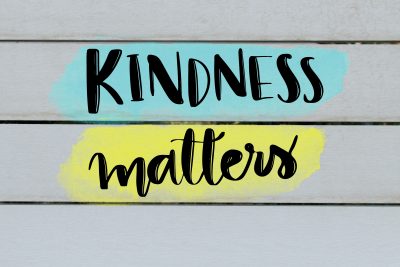 Kindness matters inspirational message on grey wooden background