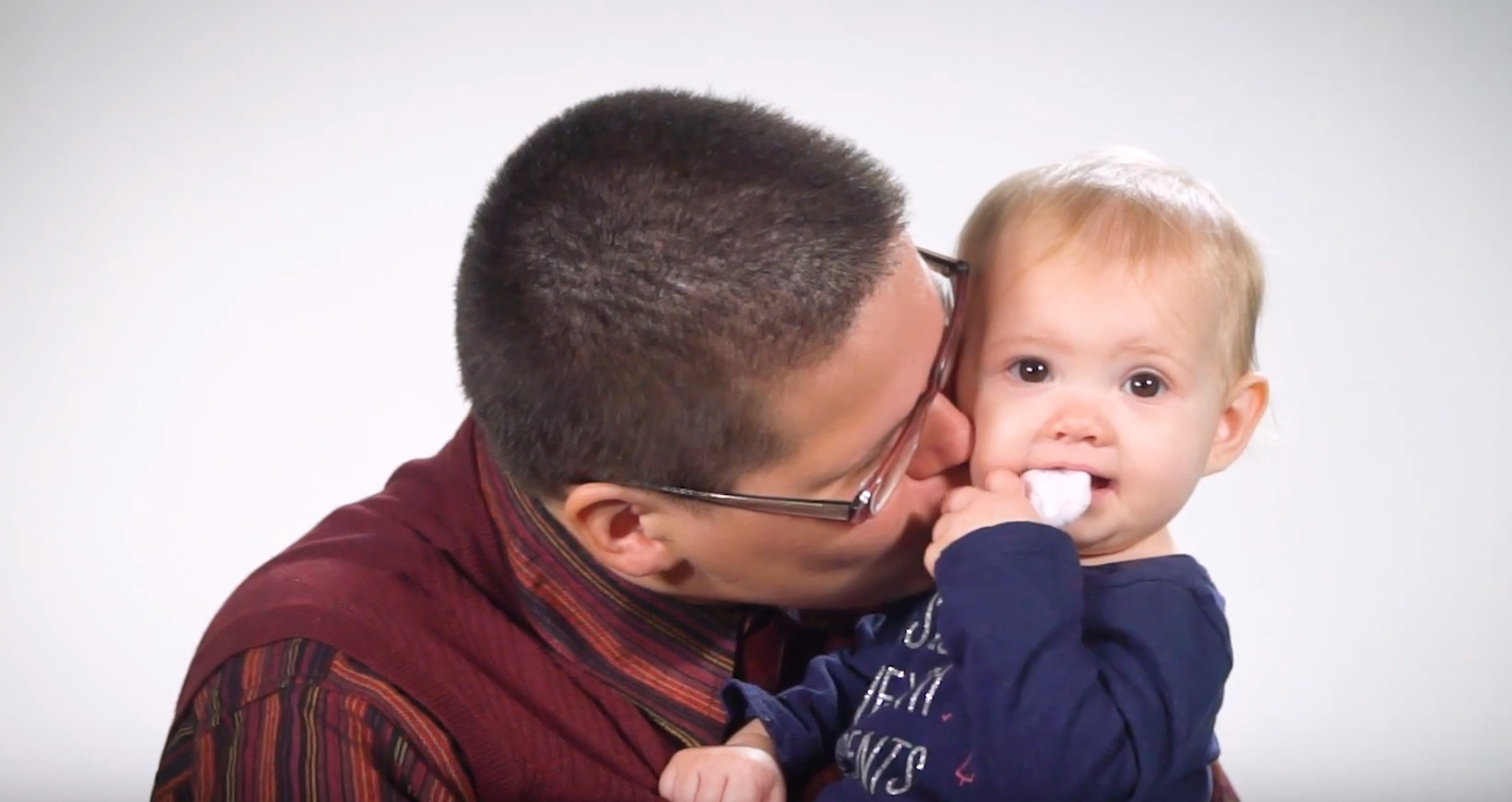 Mom kisses her child