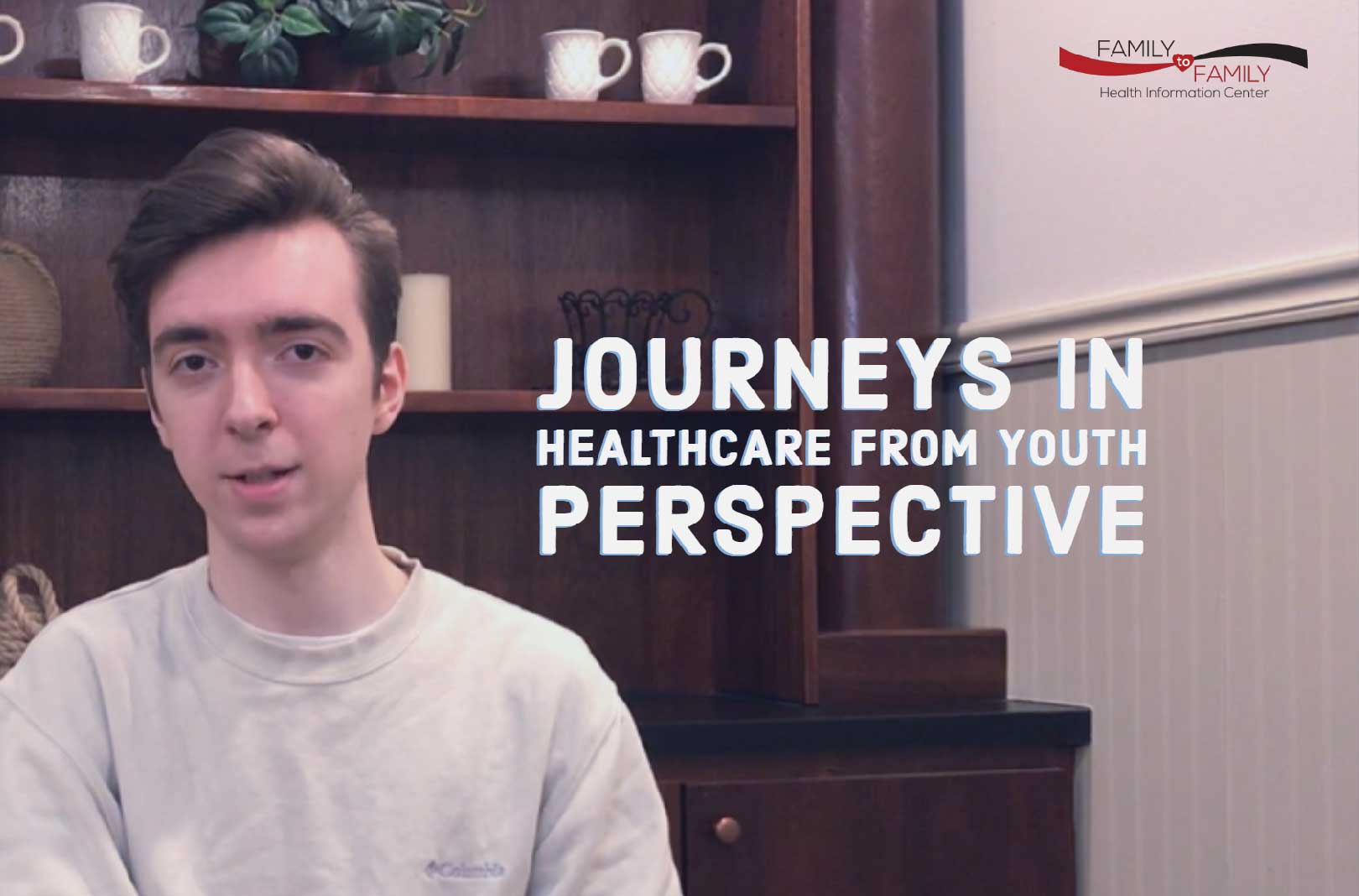 Young man poses at an office with the words Journeys in Healthcare