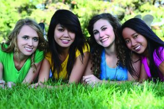 Smiling diverse teen girls