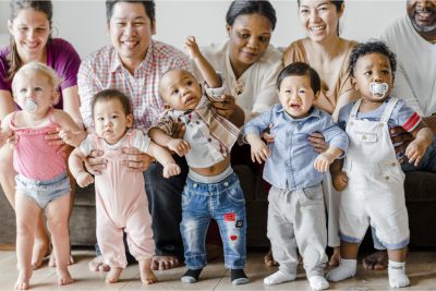 Diverse babies with their parents