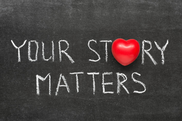 your story matters phrase handwritten on blackboard with heart symbol instead of O