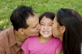 Portrait of Asian parents and their children.