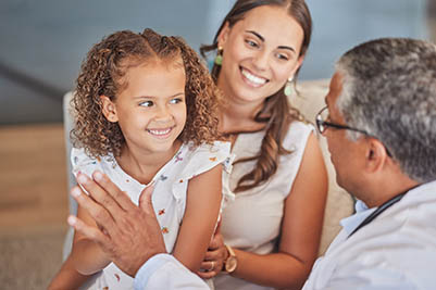 Child doctor, pediatrician and high five with happy girl patient with mom parent during health checkup with healthcare insurance. Latino kid and woman celebrate with man gp in Puerto Rico hospital
