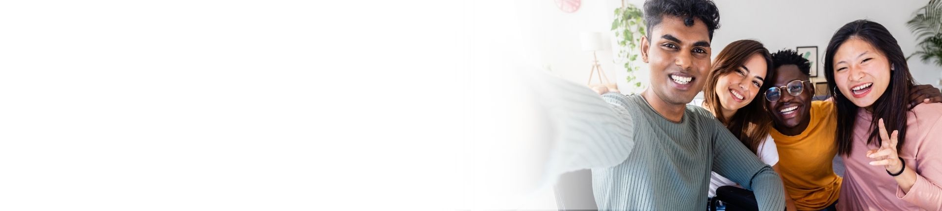 Group of Neurodiverse teens pose and smile while taking a selfie