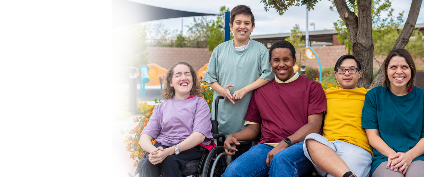 Group of Neurodiverse students smiling while outdoors